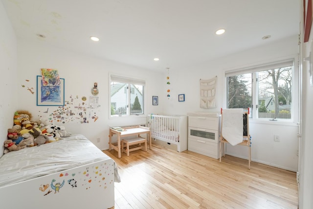 35 Turtle Cove Ln, Huntington, NY 11743 - bedroom with light wood finished floors and recessed lighting
