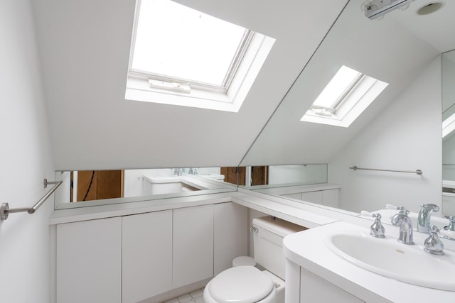 35 Turtle Cove Ln, Huntington, NY 11743 - bathroom with a skylight, vanity, and vaulted ceiling