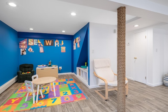 35 Turtle Cove Ln, Huntington, NY 11743 - rec room with wood tiled floors and recessed lighting