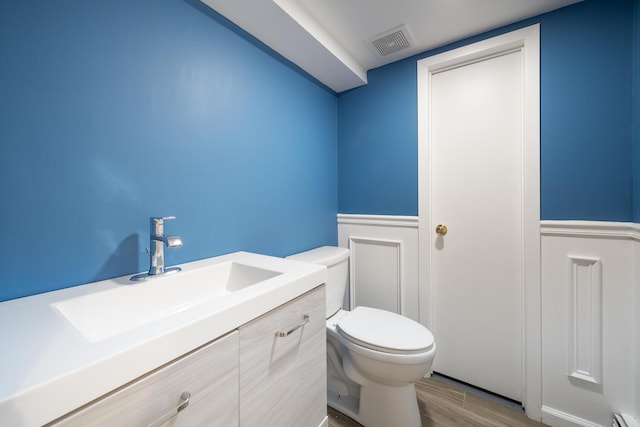 35 Turtle Cove Ln, Huntington, NY 11743 - half bath featuring vanity and wood finished floors
