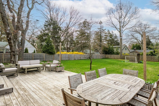 35 Turtle Cove Ln, Huntington, NY 11743 - deck with an outdoor living space, a fenced backyard, and outdoor dining area