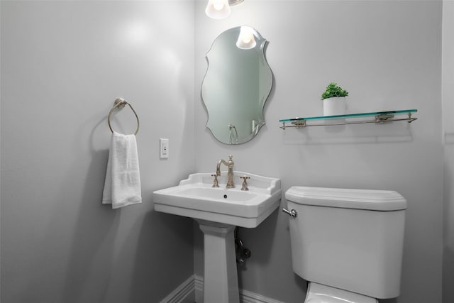half bath featuring toilet