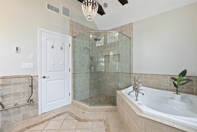full bathroom featuring a stall shower, a bath, tile patterned flooring, and inlaid floor details