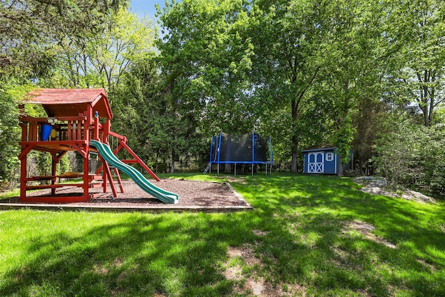communal playground with a storage shed, a trampoline, a lawn, and an outbuilding