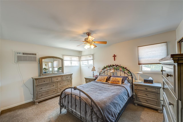 bedroom featuring an AC wall unit, carpet floors, a ceiling fan, and baseboards