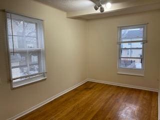 30 Treno St, New Rochelle, NY 10801 - empty room with baseboards, a ceiling fan, and wood finished floors