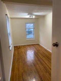 30 Treno St, New Rochelle, NY 10801 - unfurnished room featuring baseboards and wood finished floors