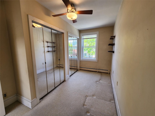 unfurnished bedroom featuring baseboards, carpet, ceiling fan, and a closet