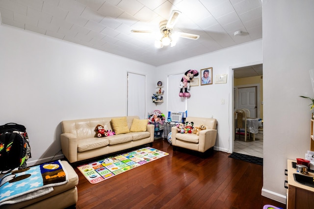 101-14 95th St, Ozone Park, NY 11416 - living room featuring ceiling fan, wood-type flooring, and baseboards