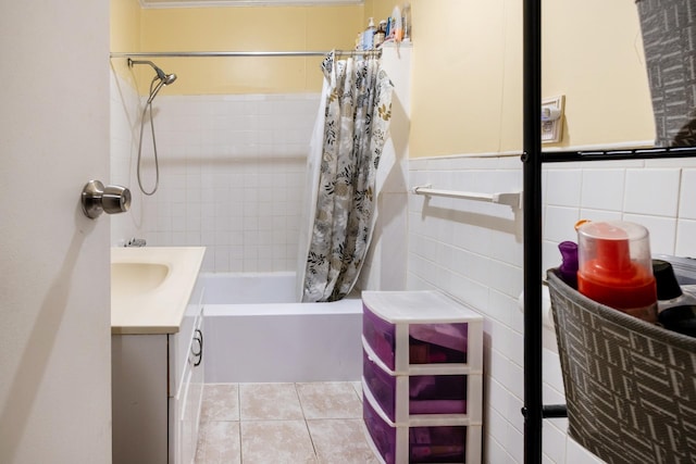 101-14 95th St, Ozone Park, NY 11416 - full bath with tile walls, shower / bath combo with shower curtain, vanity, tile patterned floors, and a wainscoted wall