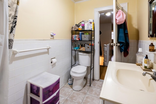 101-14 95th St, Ozone Park, NY 11416 - bathroom with tile walls, tile patterned floors, toilet, crown molding, and a sink