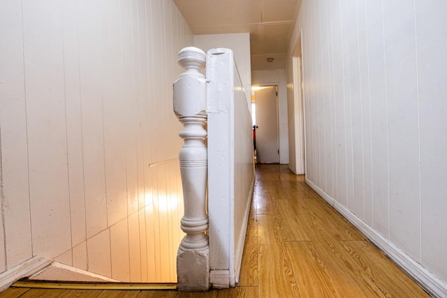 101-14 95th St, Ozone Park, NY 11416 - corridor featuring light wood-type flooring and wooden walls