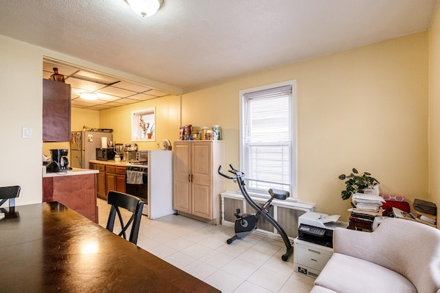 101-14 95th St, Ozone Park, NY 11416 - dining area with light tile patterned floors and radiator heating unit