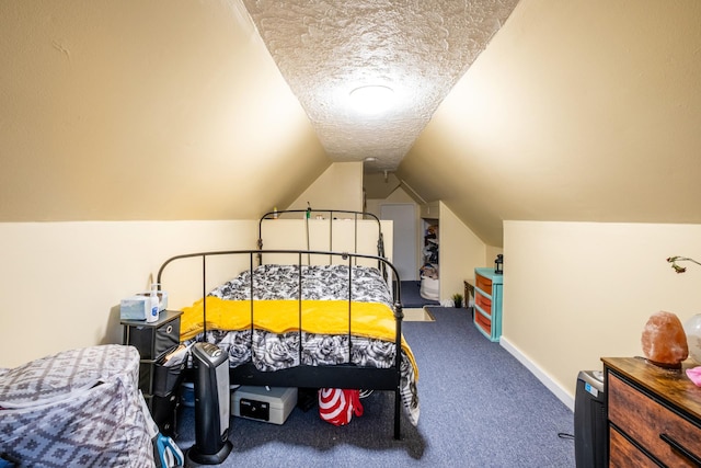101-14 95th St, Ozone Park, NY 11416 - bedroom featuring a textured ceiling, vaulted ceiling, carpet flooring, and baseboards