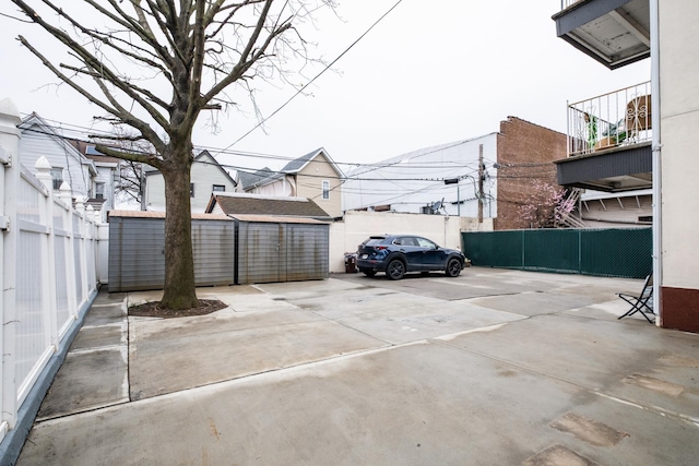 101-14 95th St, Ozone Park, NY 11416 - view of vehicle parking featuring fence and a shed