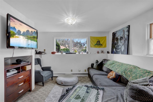 living area with a baseboard heating unit