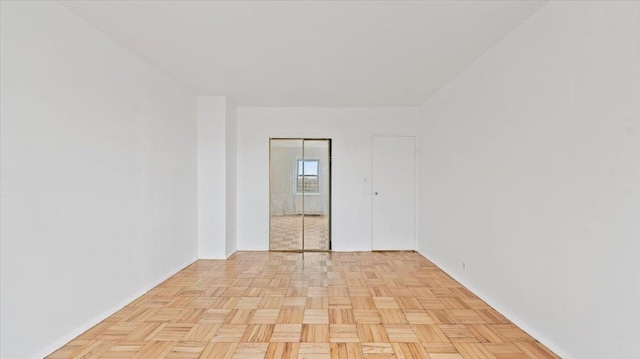 empty room with baseboards