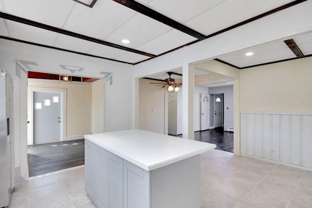 kitchen featuring light tile patterned floors, a center island, light countertops, a ceiling fan, and recessed lighting