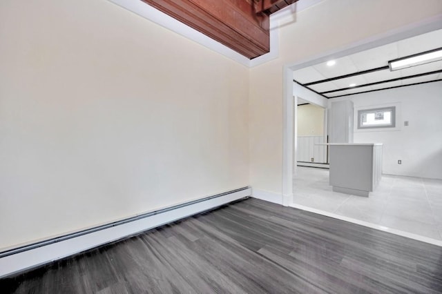 unfurnished room with a baseboard radiator, a baseboard heating unit, recessed lighting, and light wood-type flooring