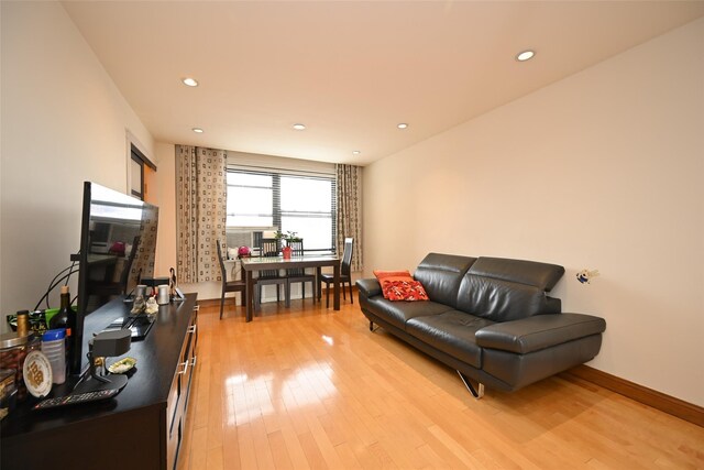 99-60 63rd Rd Unit 9Y, Rego Park, NY 11374 - living area with light wood-style floors, baseboards, and recessed lighting