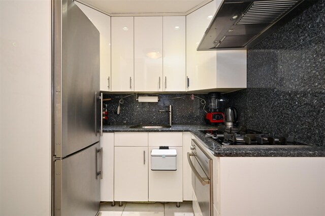 99-60 63rd Rd Unit 9Y, Rego Park, NY 11374 - kitchen featuring white cabinetry, freestanding refrigerator, extractor fan, oven, and a sink