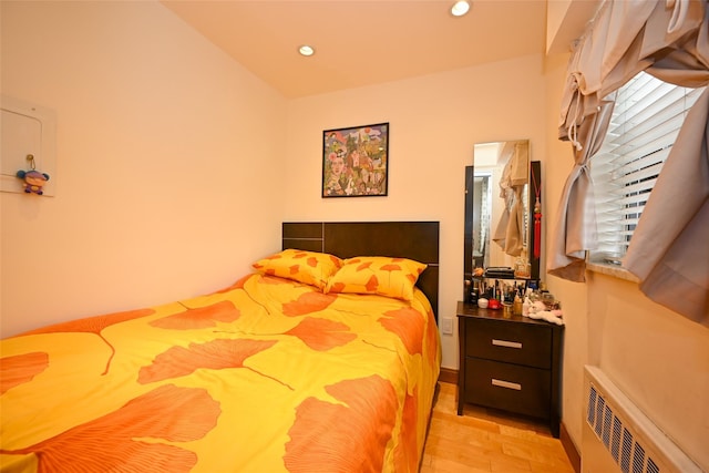 99-60 63rd Rd Unit 9Y, Rego Park, NY 11374 - bedroom with light wood-style flooring, radiator, and recessed lighting