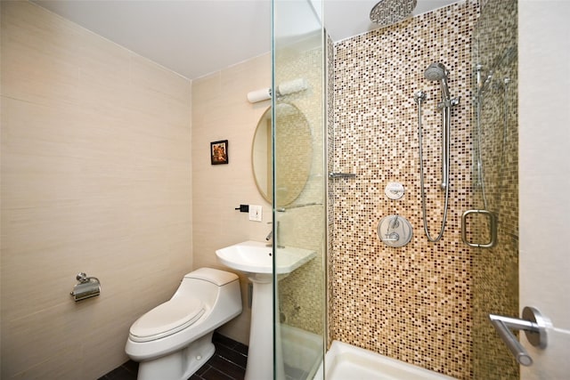 99-60 63rd Rd Unit 9Y, Rego Park, NY 11374 - bathroom with toilet, tile walls, and a stall shower