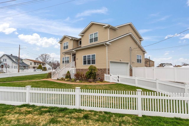 traditional-style house with a fenced backyard, a front yard, stone siding, a garage, and a residential view