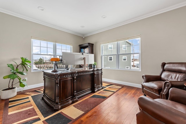 office with ornamental molding, baseboards, plenty of natural light, and hardwood / wood-style flooring