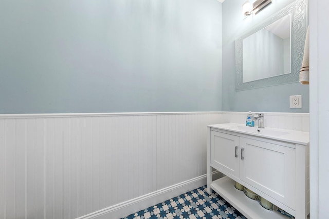 bathroom with wainscoting and vanity