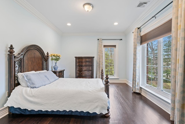 bedroom featuring visible vents, baseboards, ornamental molding, and dark wood finished floors