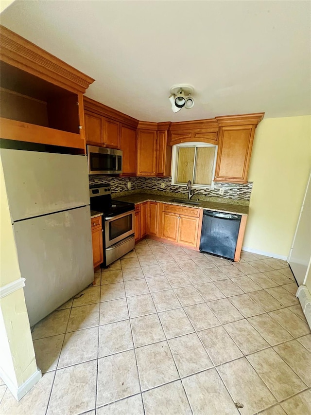 7 Murray Ln, Coram, NY 11727 - kitchen with stainless steel appliances, backsplash, light tile patterned flooring, and dark countertops