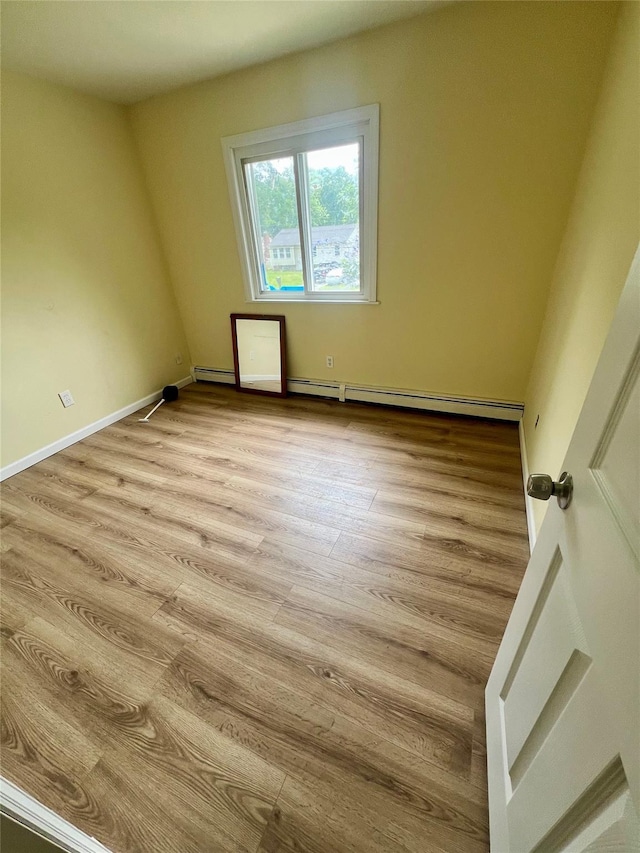 7 Murray Ln, Coram, NY 11727 - spare room with light wood-style flooring and baseboards
