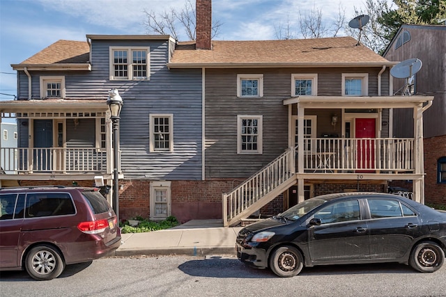 20 E Parmenter St, Newburgh, NY 12550 - view of front facade with covered porch, stairs, and a chimney