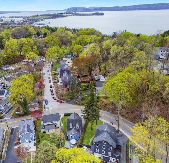 birds eye view of property featuring a water view and a residential view