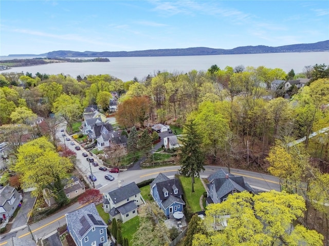 aerial view featuring a water and mountain view and a residential view