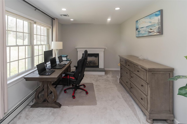 office area with light colored carpet, baseboards, a glass covered fireplace, and recessed lighting
