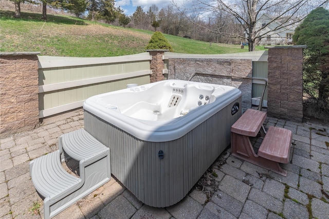 view of patio / terrace with cooling unit and a hot tub