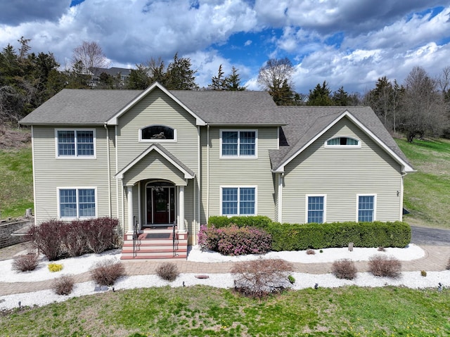 view of front of property with a shingled roof