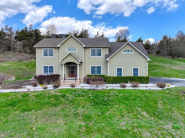 view of front of home with a front lawn