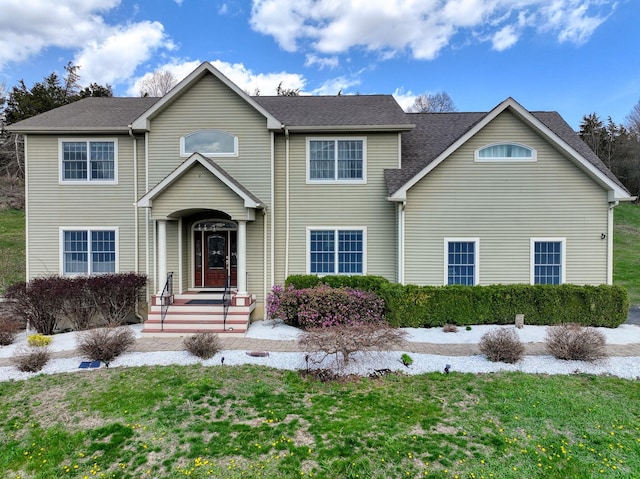 traditional home with a front lawn
