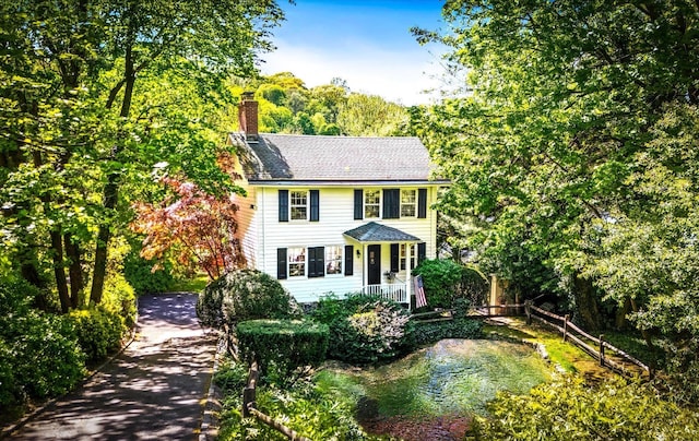 80 E Broadway, Roslyn, NY 11576 - colonial home with a chimney
