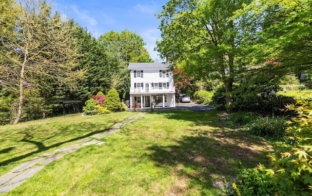 80 E Broadway, Roslyn, NY 11576 - rear view of property featuring a lawn and a porch