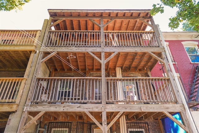 138 S Clark St, Newburgh, NY 12550 - back of house with brick siding and a balcony