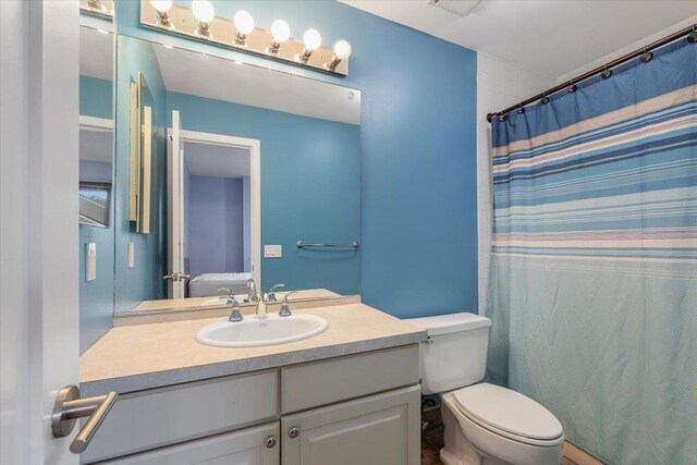 19 James Ct Unit 19, Port Chester, NY 10573 - ensuite bathroom with vanity, toilet, and a shower with curtain