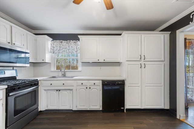 kitchen with crown molding, a sink, white cabinetry, light countertops, and appliances with stainless steel finishes