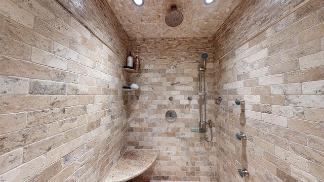 full bathroom with tiled shower and recessed lighting