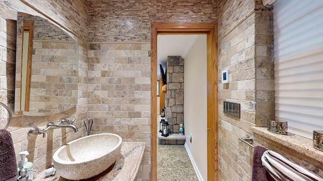 bathroom with baseboards