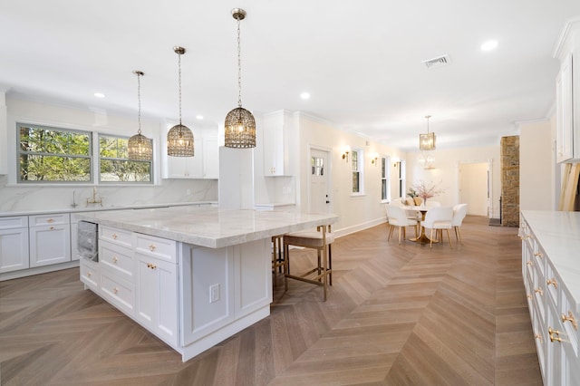 56 Drake Rd, Scarsdale, NY 10583 - kitchen featuring a chandelier, recessed lighting, white cabinets, a center island, and a kitchen breakfast bar