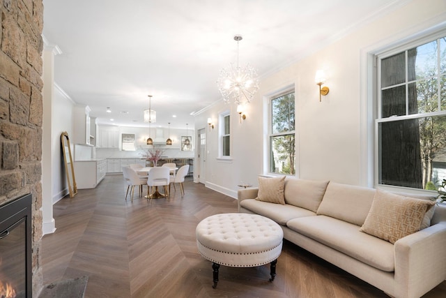 56 Drake Rd, Scarsdale, NY 10583 - living room featuring crown molding, a chandelier, healthy amount of natural light, a fireplace, and baseboards